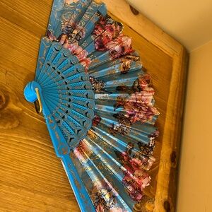 Blue background floral design Style Hand Fan with gold tone  accents 15 “ across